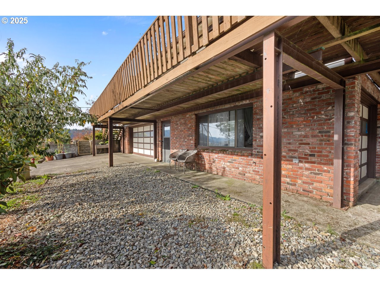 205 Marsh Street Gardiner, OR 97441 - Photo 12 of 46 a view of a house with backyard and porch