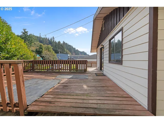 a view of outdoor space with deck and yard