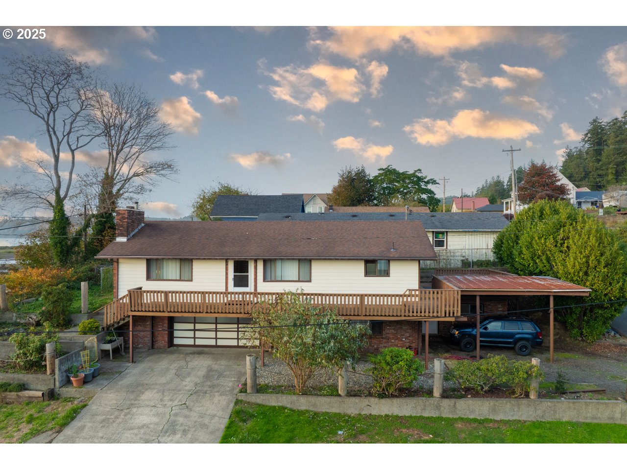205 Marsh Street Gardiner, OR 97441 - Photo 2 of 46 a house view with a garden space