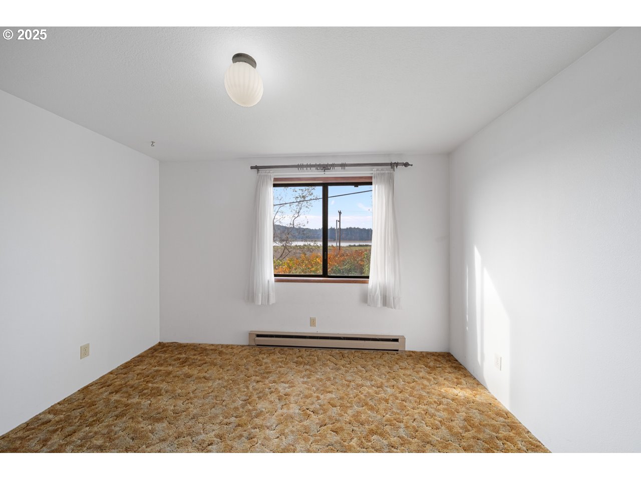 205 Marsh Street Gardiner, OR 97441 - Photo 29 of 46 a view of an empty room and window