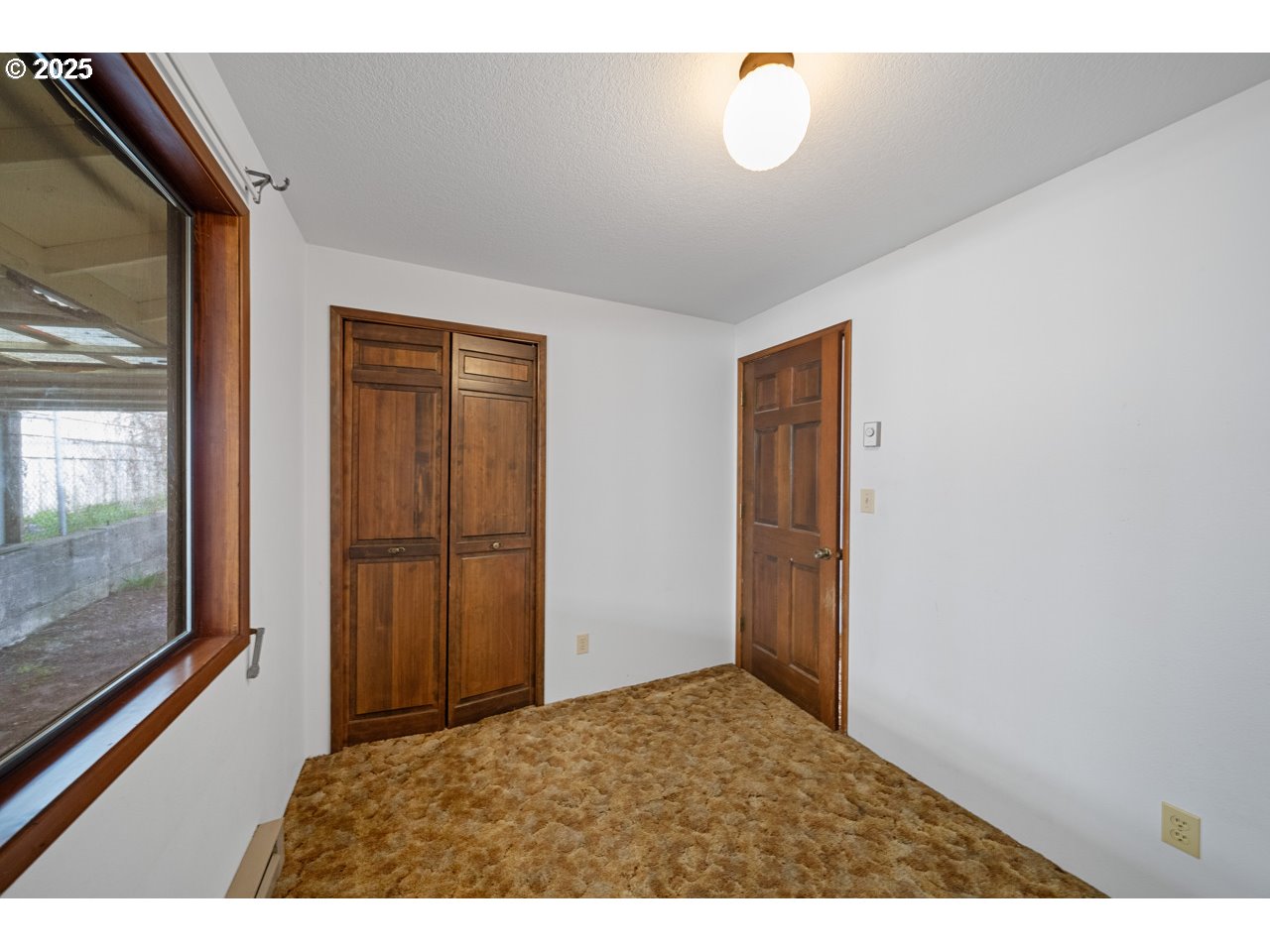 205 Marsh Street Gardiner, OR 97441 - Photo 36 of 46 a view of an empty room and window