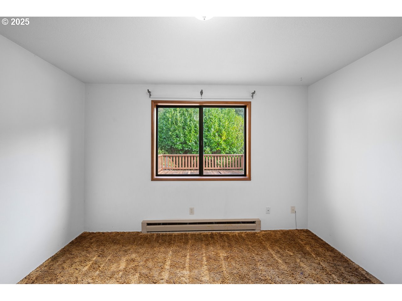 205 Marsh Street Gardiner, OR 97441 - Photo 37 of 46 an empty room with a window