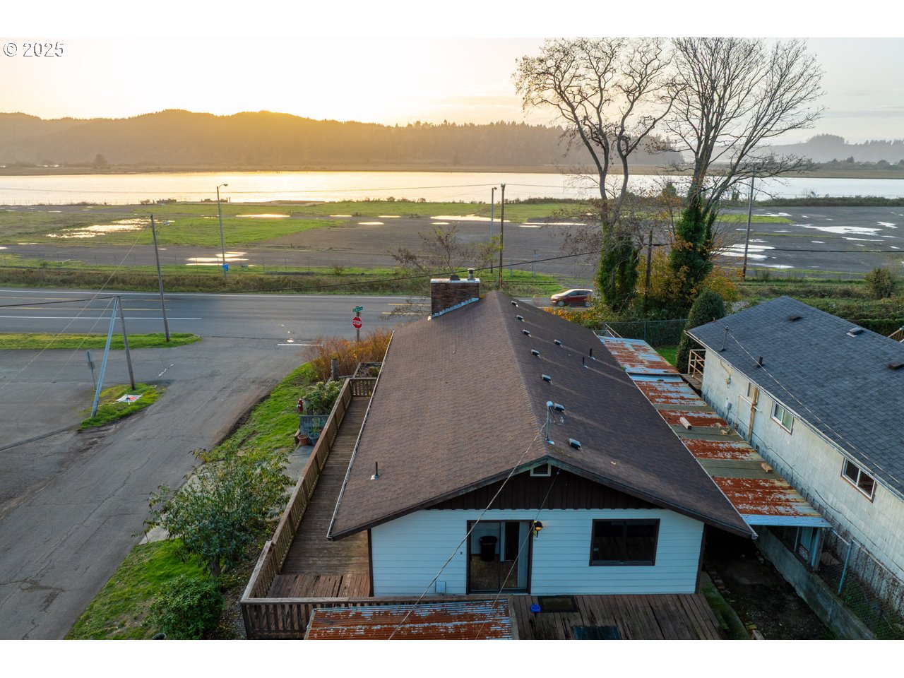 205 Marsh Street Gardiner, OR 97441 - Photo 7 of 46 a view of a city from a lake