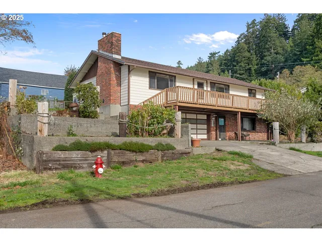 a front view of a house with a yard table and chairs
