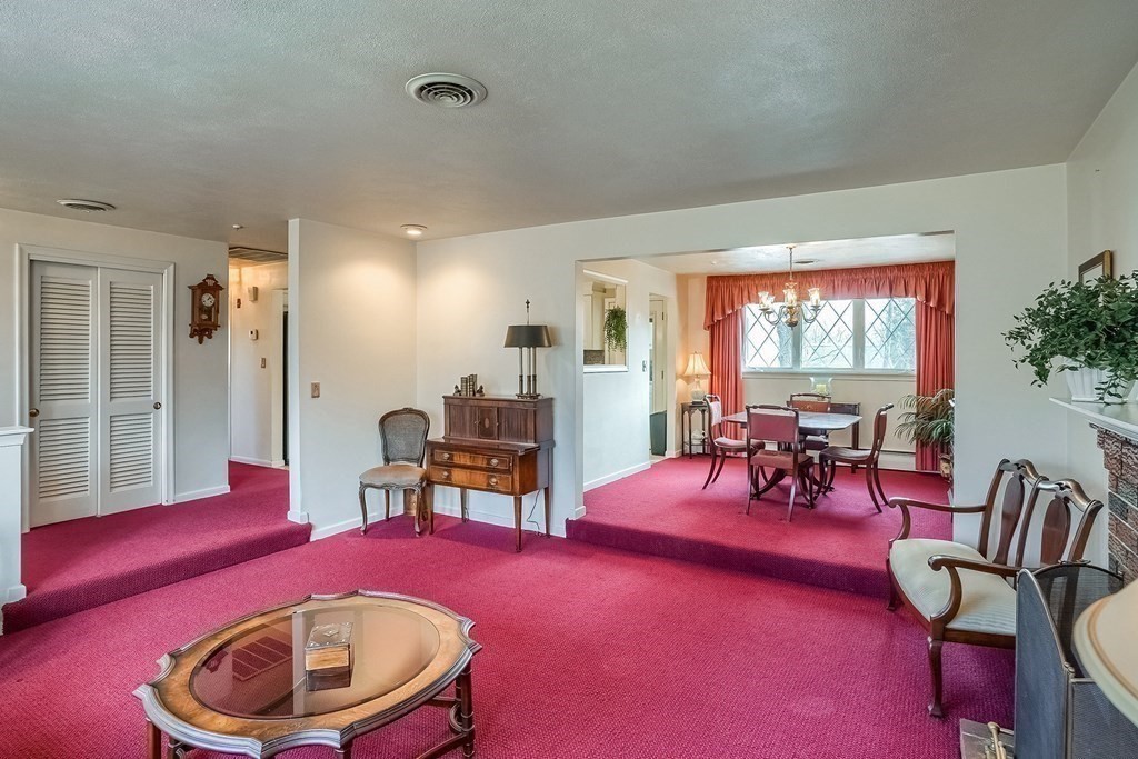 10 Sullivan Drive Randolph, MA 02368 - Photo 11 of 40 a living room with furniture and a large window
