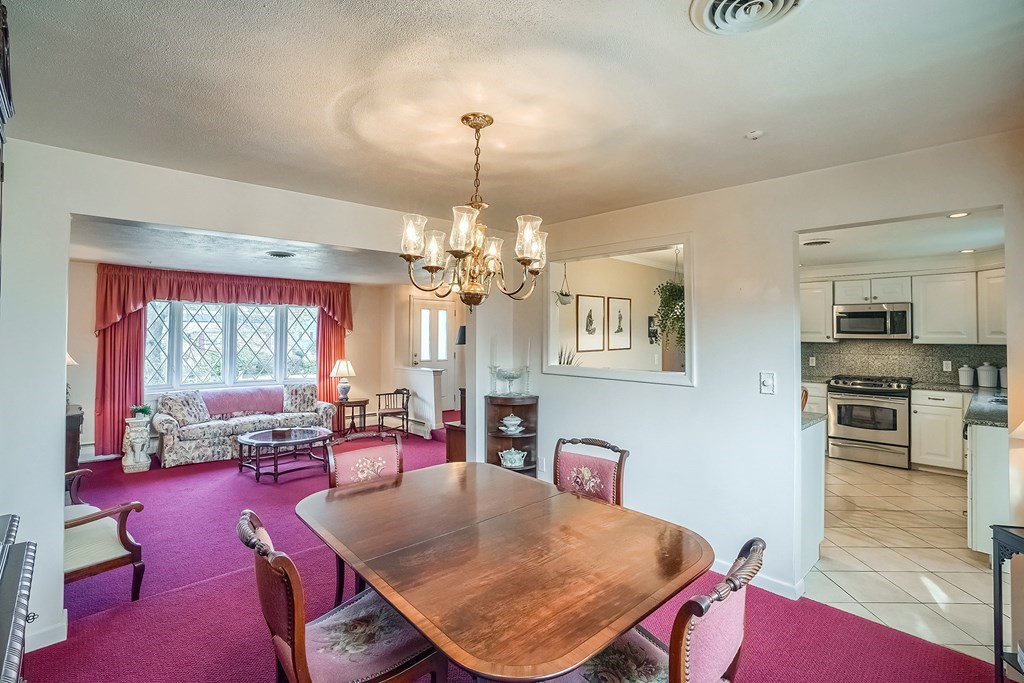 10 Sullivan Drive Randolph, MA 02368 - Photo 13 of 40 a view of a dining room with furniture window and outside view