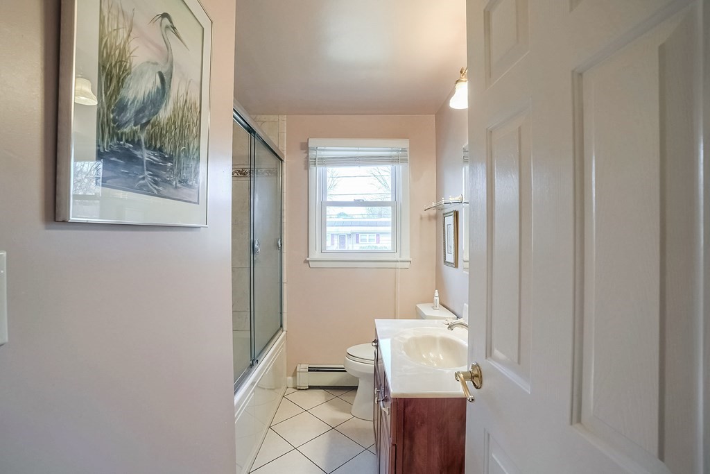 10 Sullivan Drive Randolph, MA 02368 - Photo 18 of 40 a bathroom with a sink and a mirror