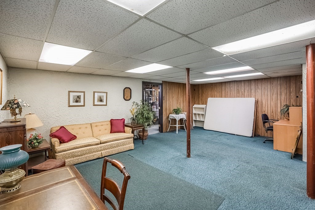 10 Sullivan Drive Randolph, MA 02368 - Photo 27 of 40 a living room with furniture and a wooden floor