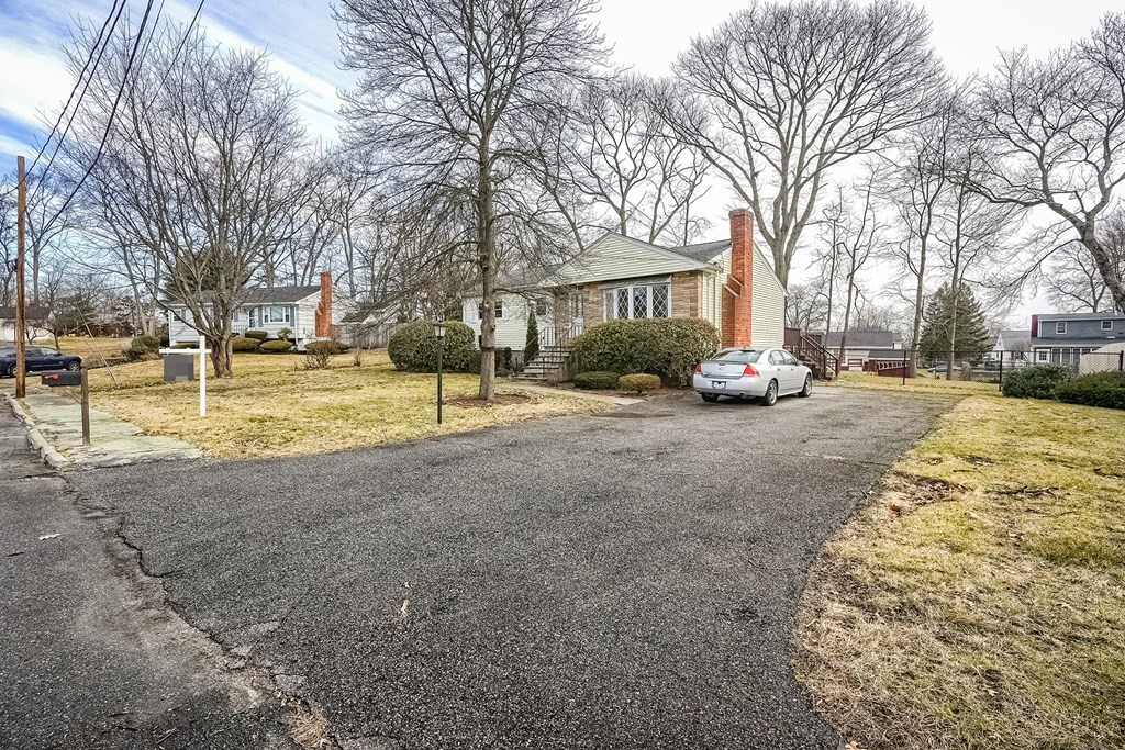 10 Sullivan Drive Randolph, MA 02368 - Photo 3 of 40 a view of road with trees