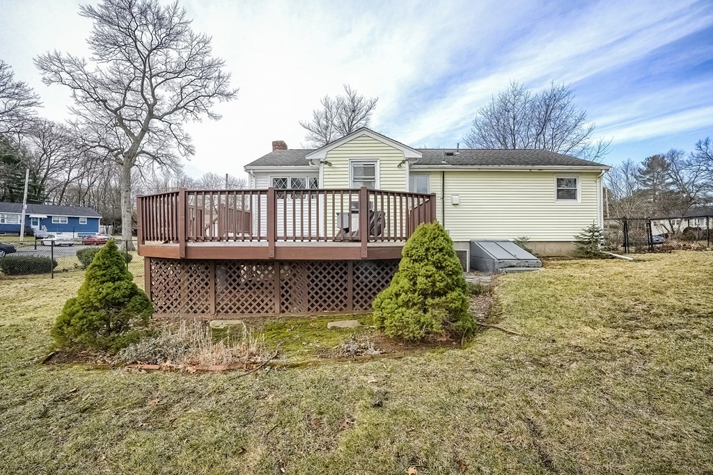 10 Sullivan Drive Randolph, MA 02368 - Photo 35 of 40 a view of a house with a wooden deck