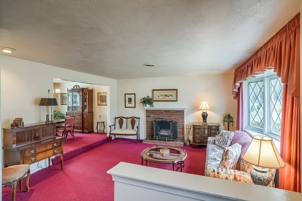 10 Sullivan Drive Randolph, MA 02368 - Photo 8 of 40 a living room with furniture and a fireplace