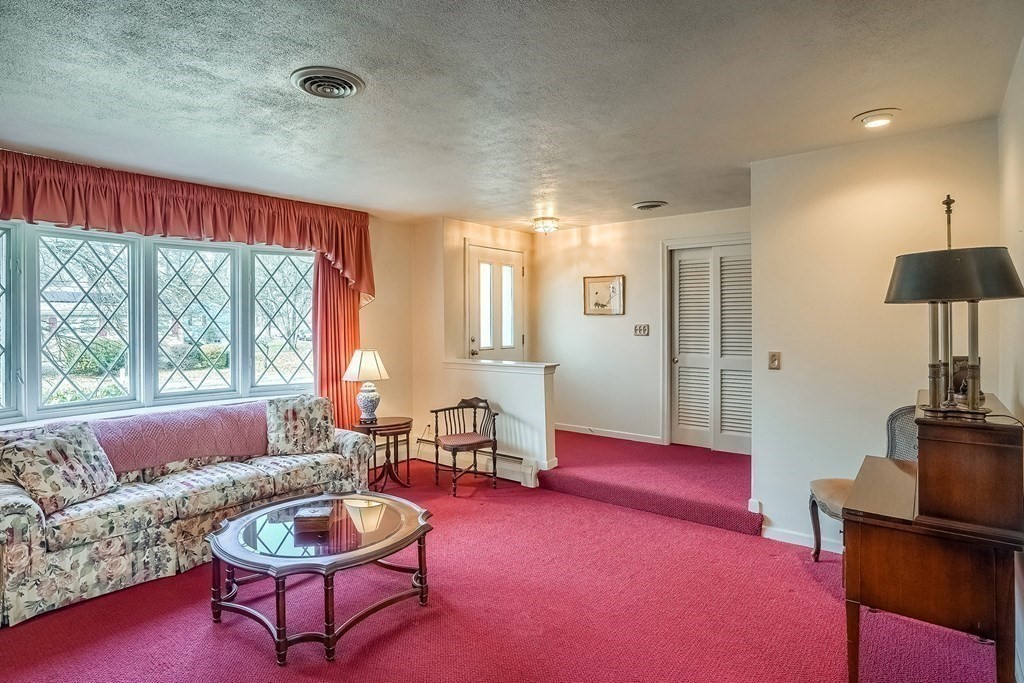 10 Sullivan Drive Randolph, MA 02368 - Photo 10 of 40 a living room with furniture and a large window
