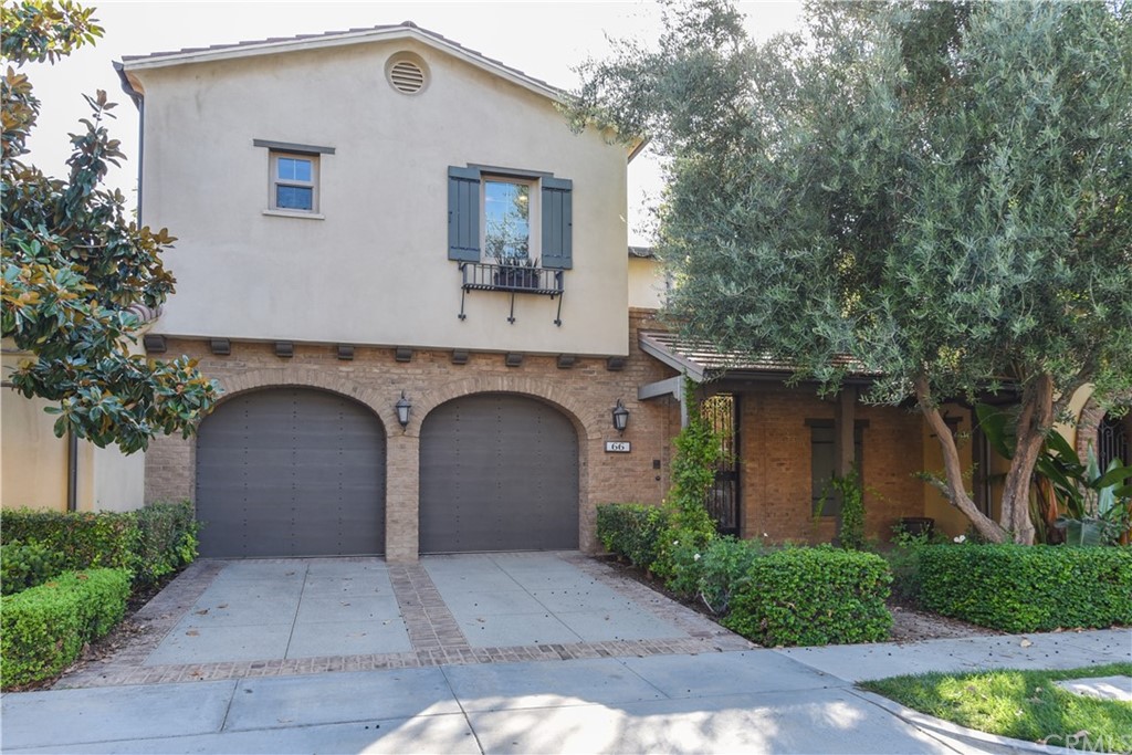 66 Homeland Irvine, CA 92618 - Photo 1 of 1 a front view of a house with a garden