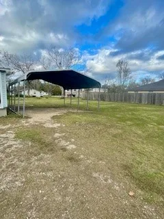 a view of a patio with a table and chairs