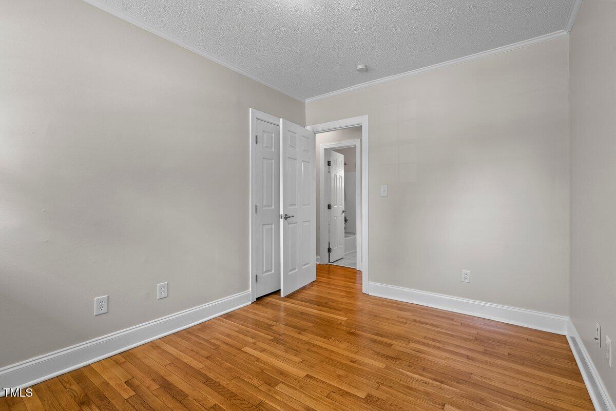 202 Purvis Street Garner, NC 27529 - Photo 16 of 28 a view of a room with wooden floor