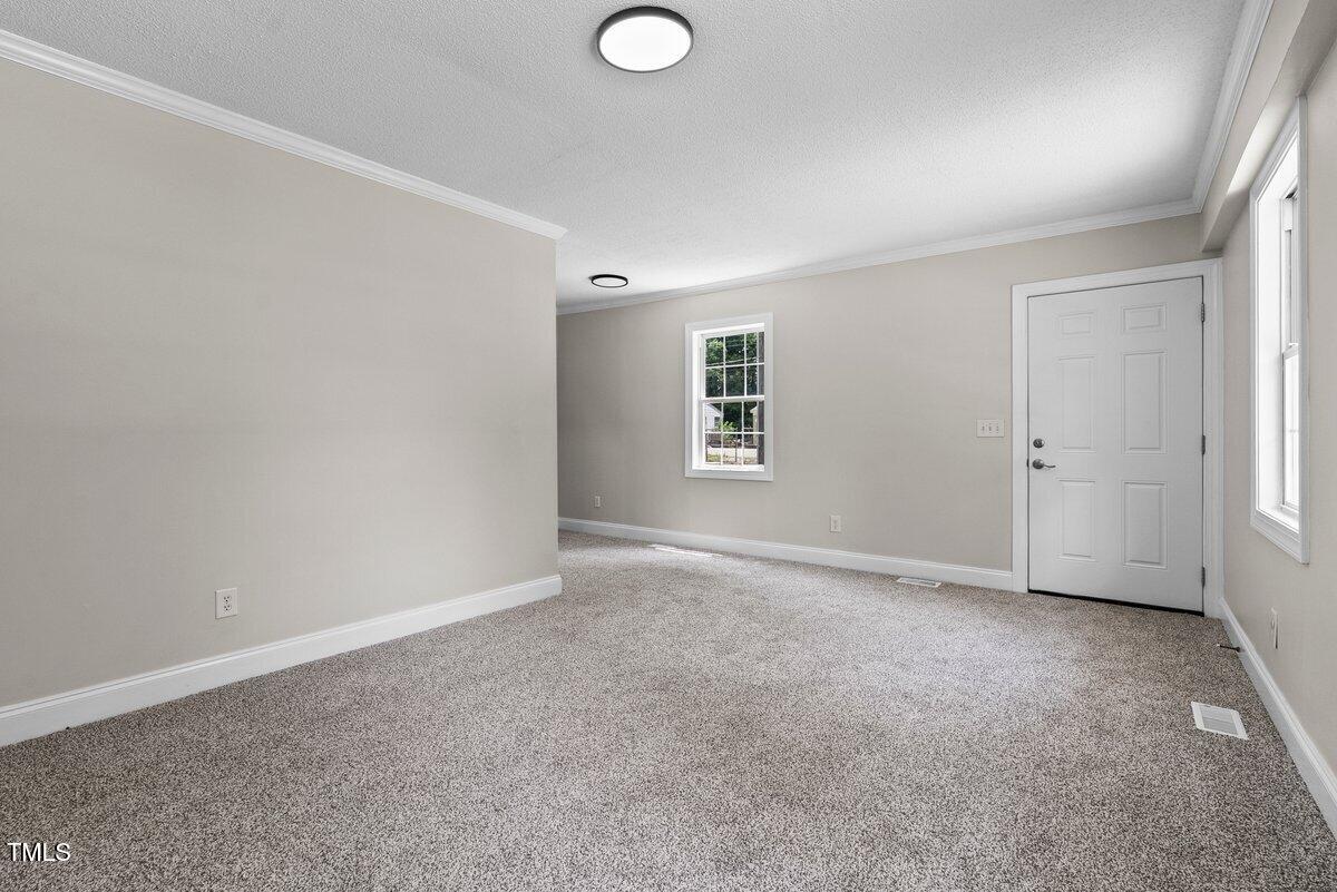 202 Purvis Street Garner, NC 27529 - Photo 19 of 28 an empty room with windows and closet