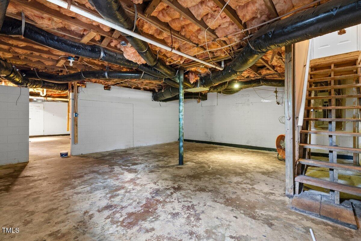 202 Purvis Street Garner, NC 27529 - Photo 22 of 28 a view of a room with wooden walls