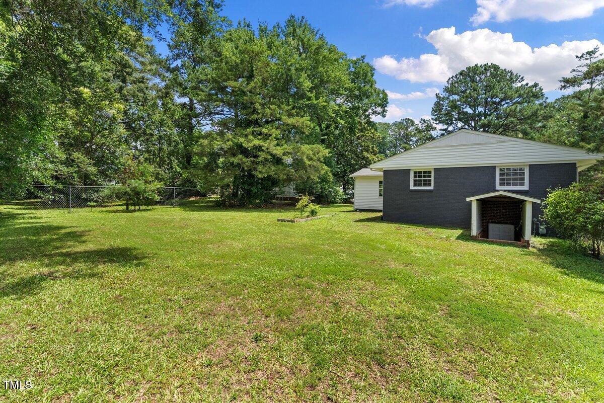 202 Purvis Street Garner, NC 27529 - Photo 23 of 28 a front view of house with yard and green space