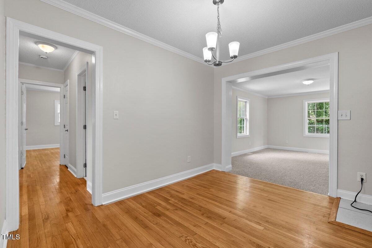 202 Purvis Street Garner, NC 27529 - Photo 7 of 28 a view of livingroom with hardwood floor and window