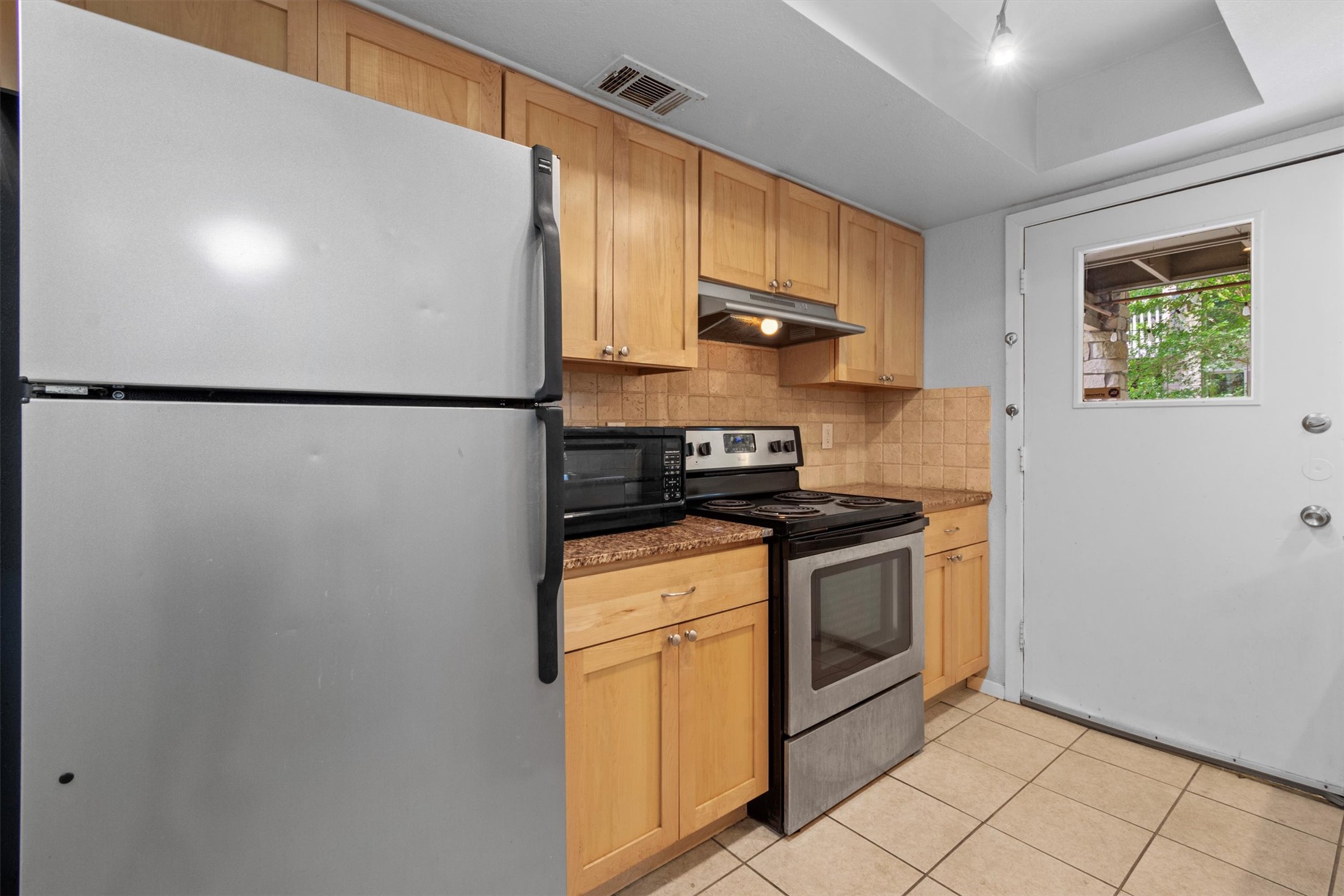 3627 Menchaca Road, Unit 204 Austin, TX 78704 - Photo 6 of 23 A well-appointed kitchen features modern appliances and a functional layout for daily living.