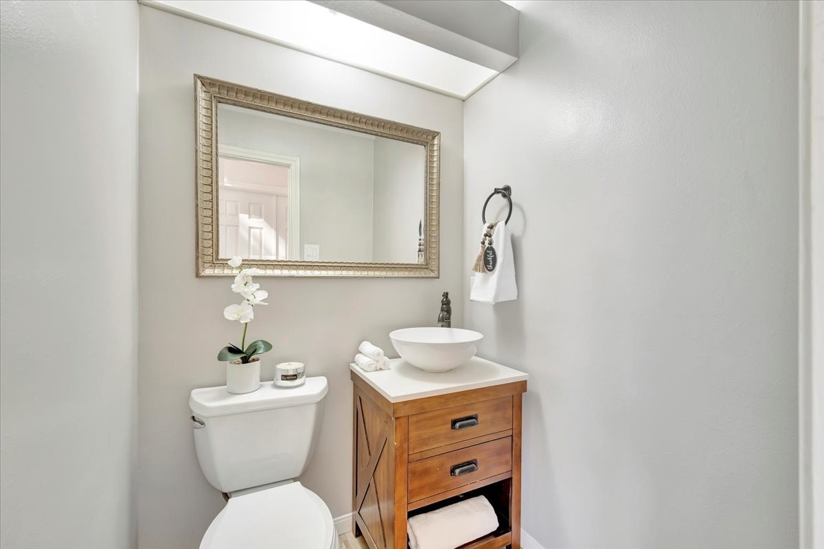 15131 Cranbourne Drive Houston, TX 77062 - Photo 16 of 42 a bathroom with a toilet sink and mirror