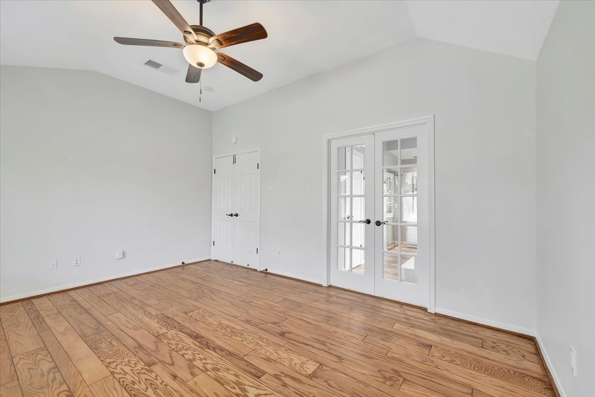15131 Cranbourne Drive Houston, TX 77062 - Photo 18 of 42 a view of empty room with wooden floor