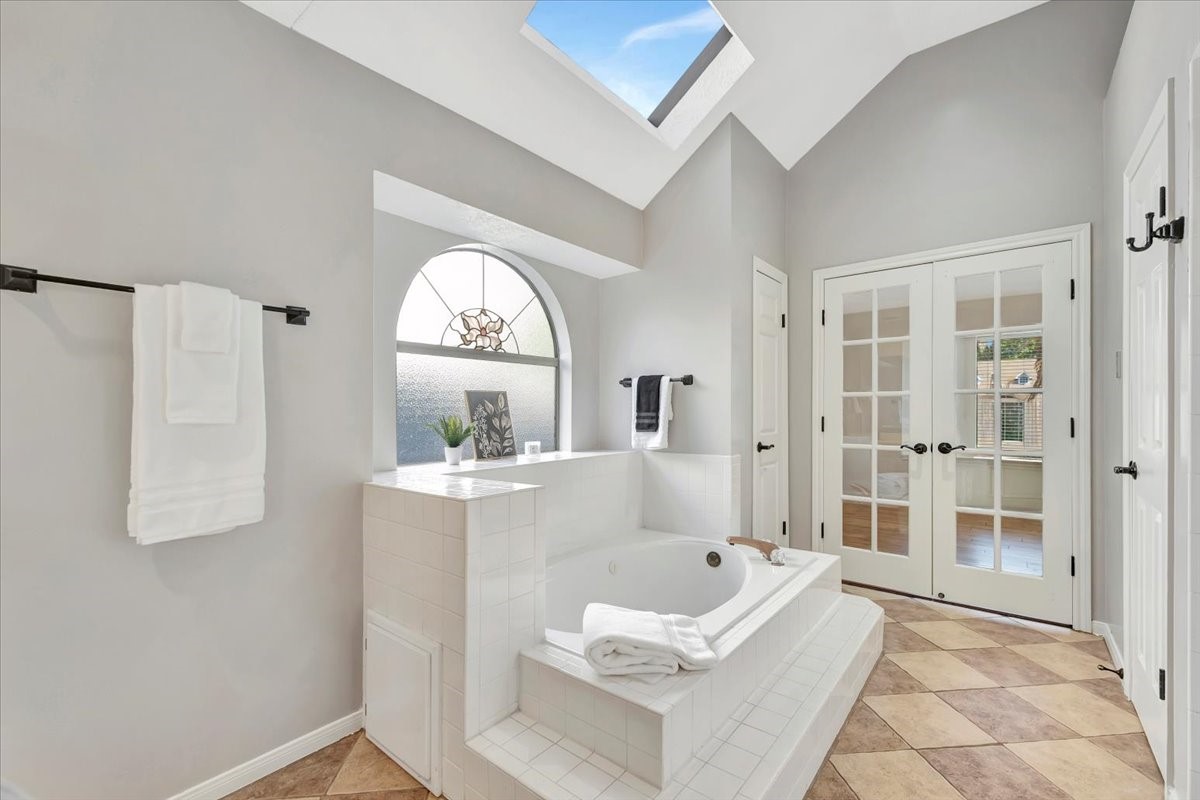 15131 Cranbourne Drive Houston, TX 77062 - Photo 20 of 42 a large white tub sitting in a bathroom