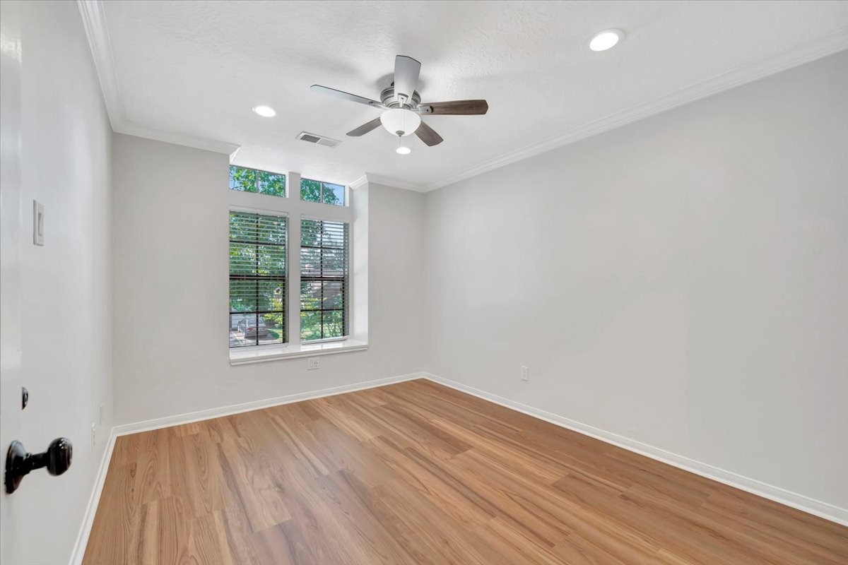 15131 Cranbourne Drive Houston, TX 77062 - Photo 26 of 42 wooden floor in an empty room with a window