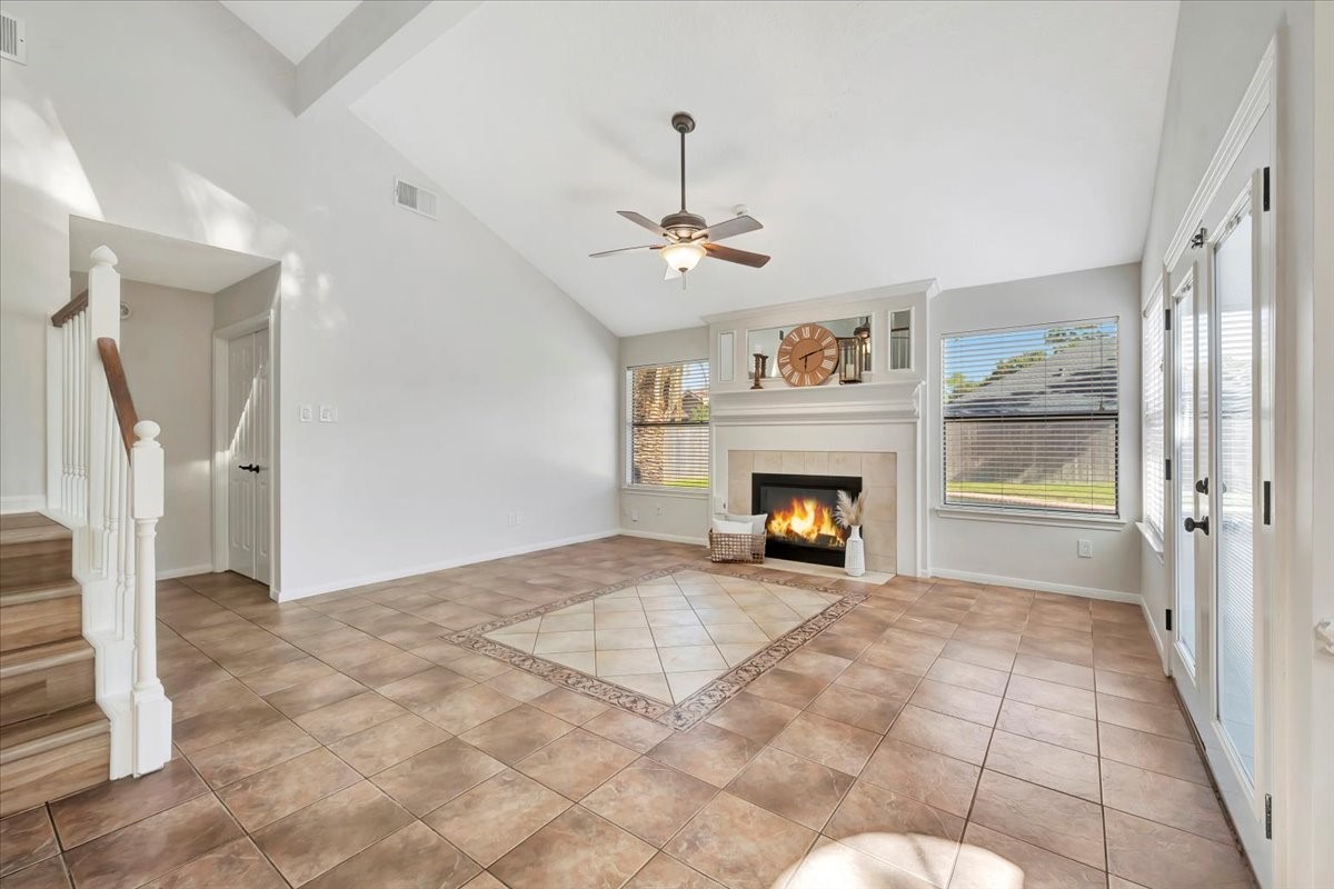 15131 Cranbourne Drive Houston, TX 77062 - Photo 3 of 42 a view of an empty room with a fireplace and a window