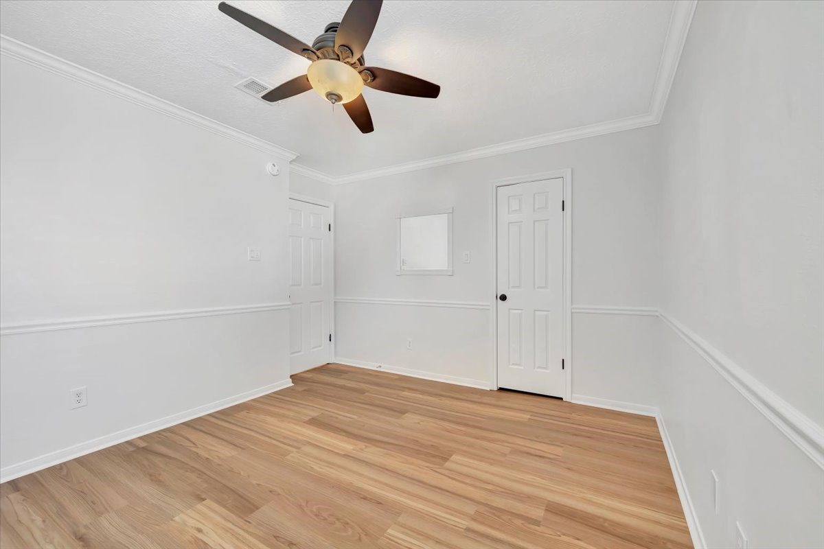 15131 Cranbourne Drive Houston, TX 77062 - Photo 31 of 42 an empty room with a empty space and a ceiling fan