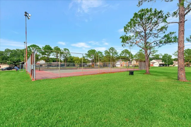 a view of swimming pool with a yard