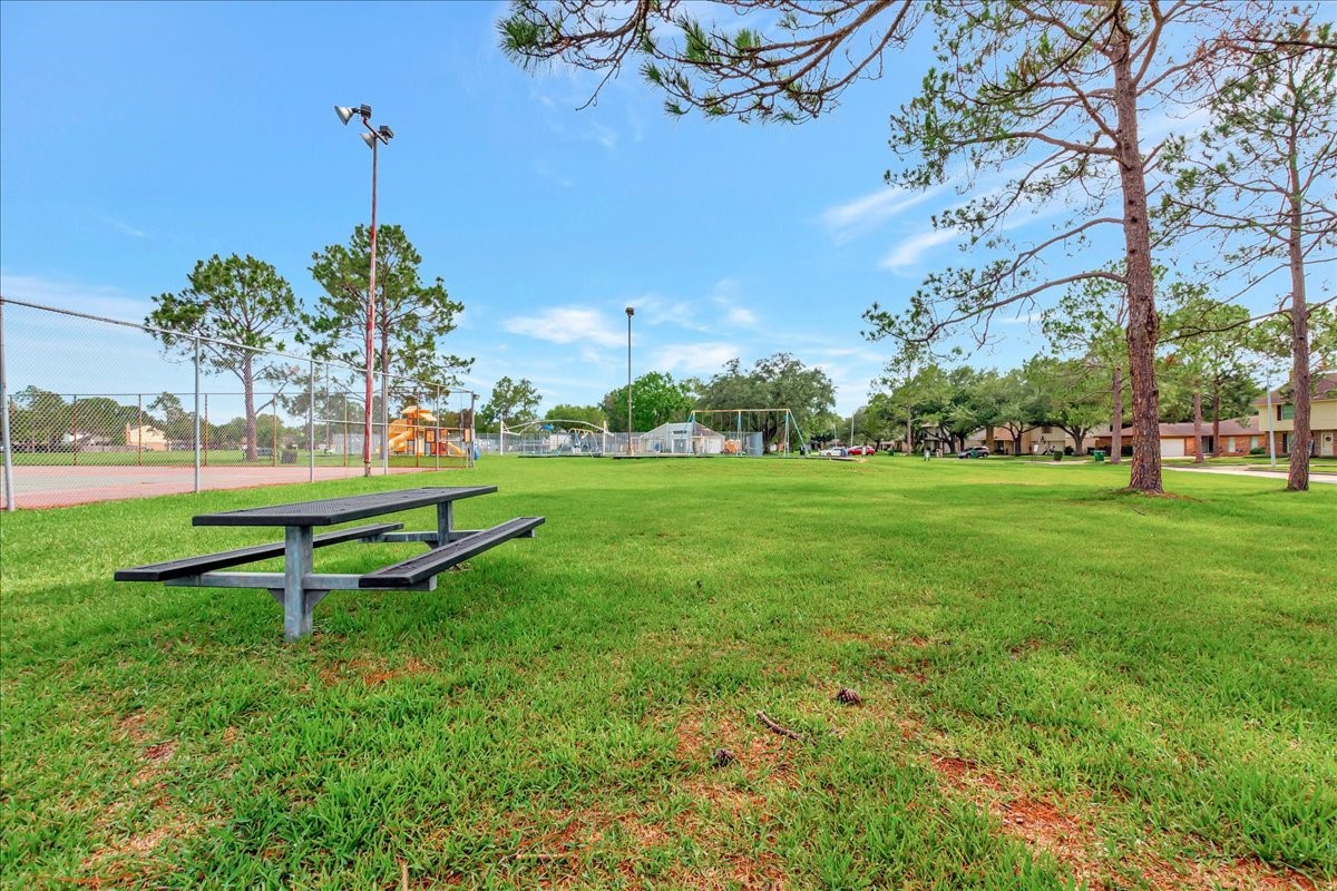 15131 Cranbourne Drive Houston, TX 77062 - Photo 41 of 42 a garden with a bench in garden