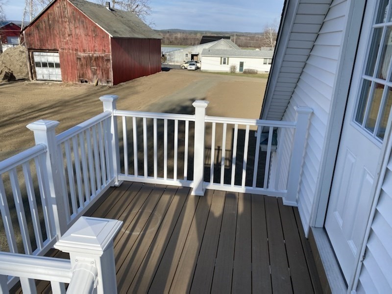 82 Comins Road, Unit 2 Hadley, MA 01035 - Photo 4 of 12 a view of a balcony with wooden floor
