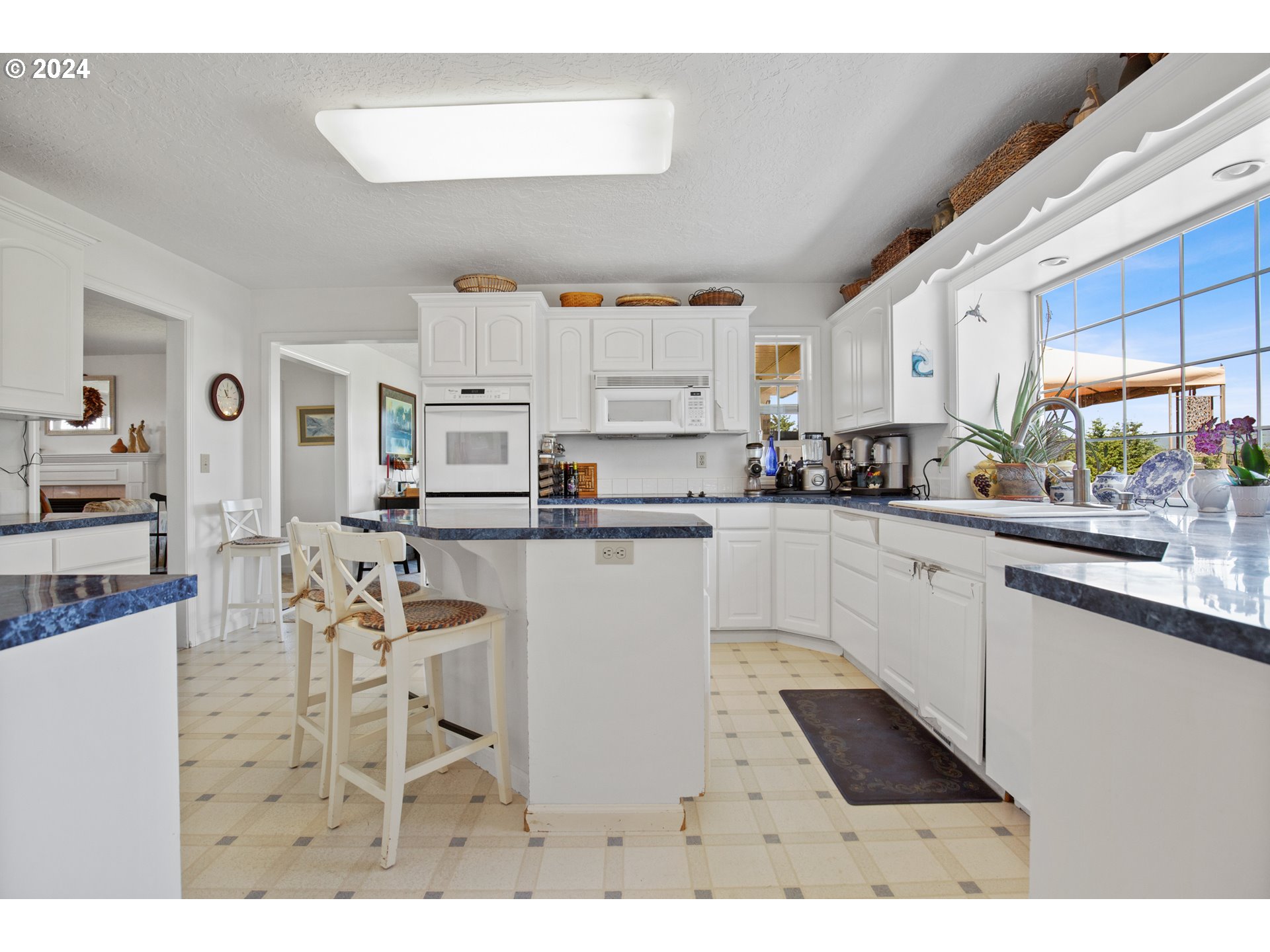 25059 Larson Road Monroe, OR 97456 - Photo 11 of 38 a kitchen with stainless steel appliances kitchen island granite countertop a sink and cabinets