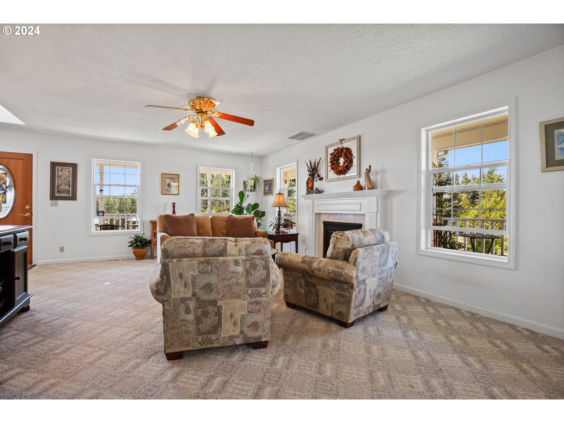 25059 Larson Road Monroe, OR 97456 - Photo 17 of 38 a living room with furniture and a fireplace