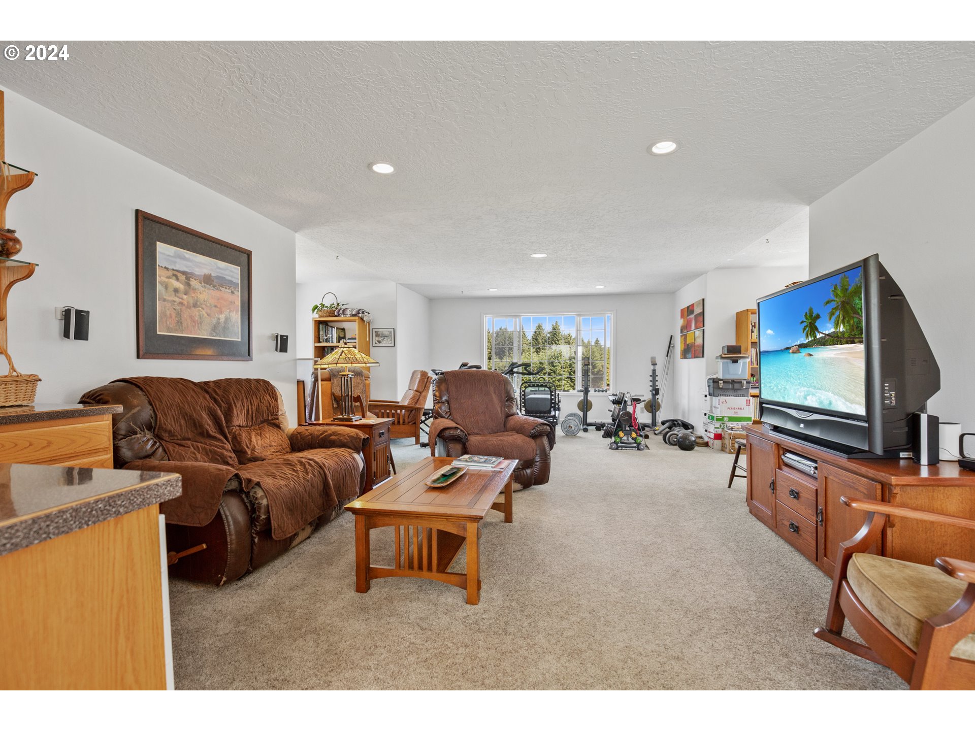 25059 Larson Road Monroe, OR 97456 - Photo 21 of 38 a living room with furniture and a flat screen tv