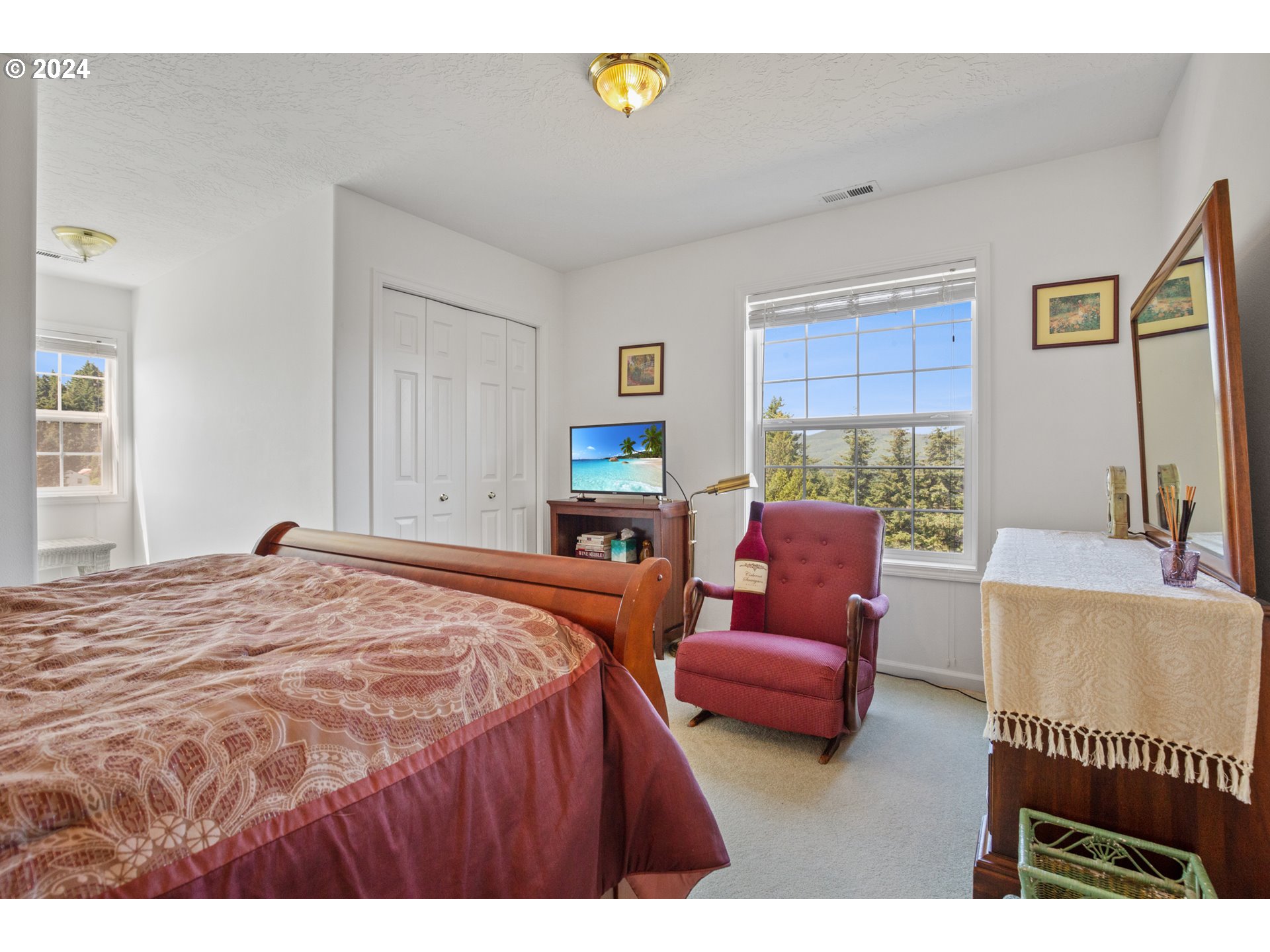 25059 Larson Road Monroe, OR 97456 - Photo 25 of 38 a bedroom with a bed and a couch