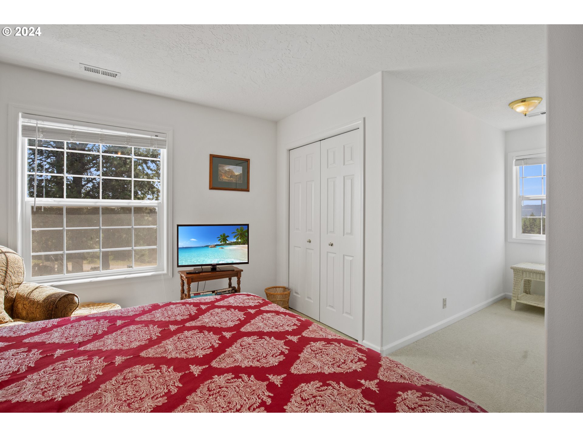 25059 Larson Road Monroe, OR 97456 - Photo 26 of 38 a bedroom with a bed and wooden floor