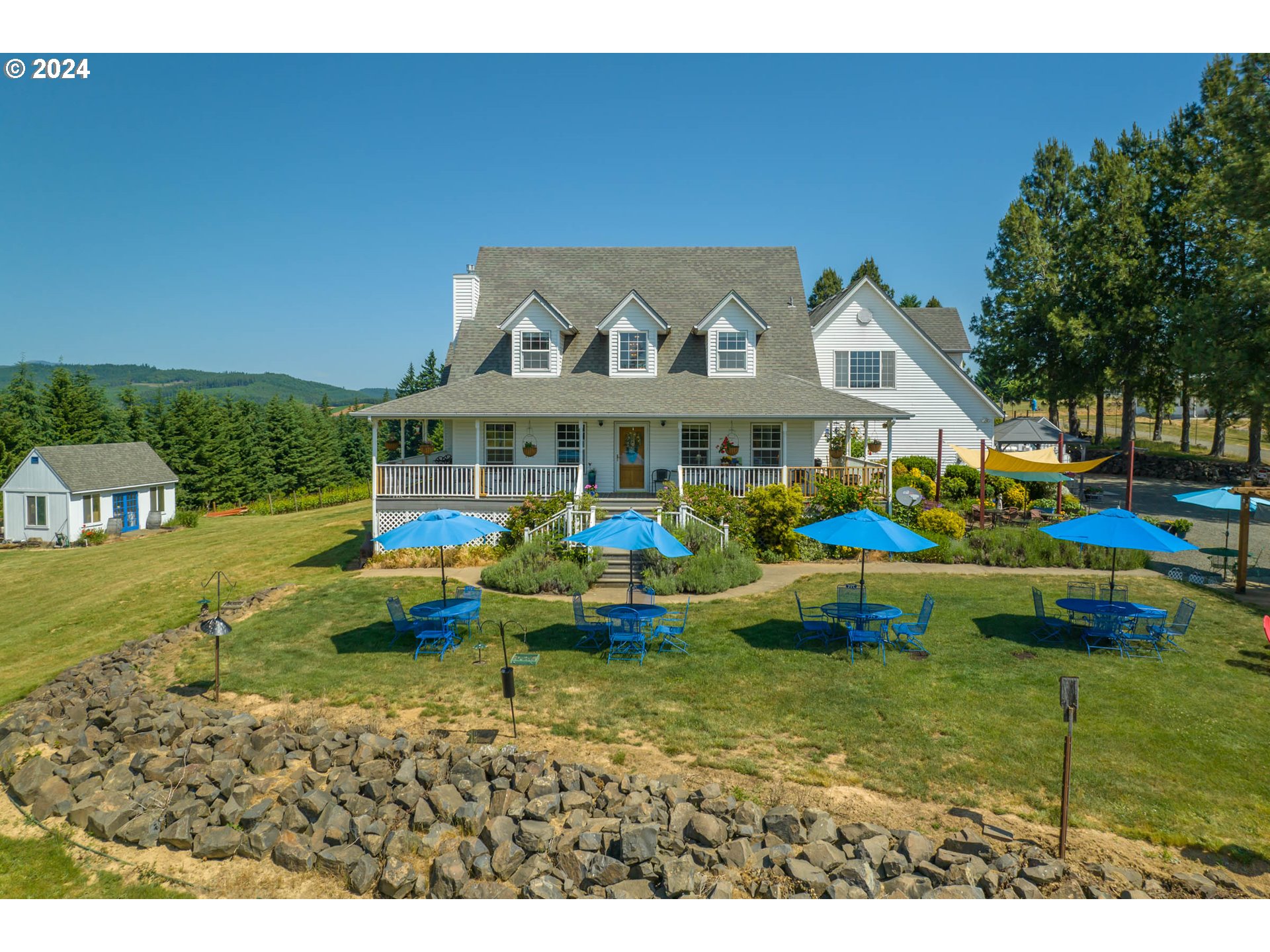 25059 Larson Road Monroe, OR 97456 - Photo 34 of 38 a view of swimming pool with lawn chairs and plants