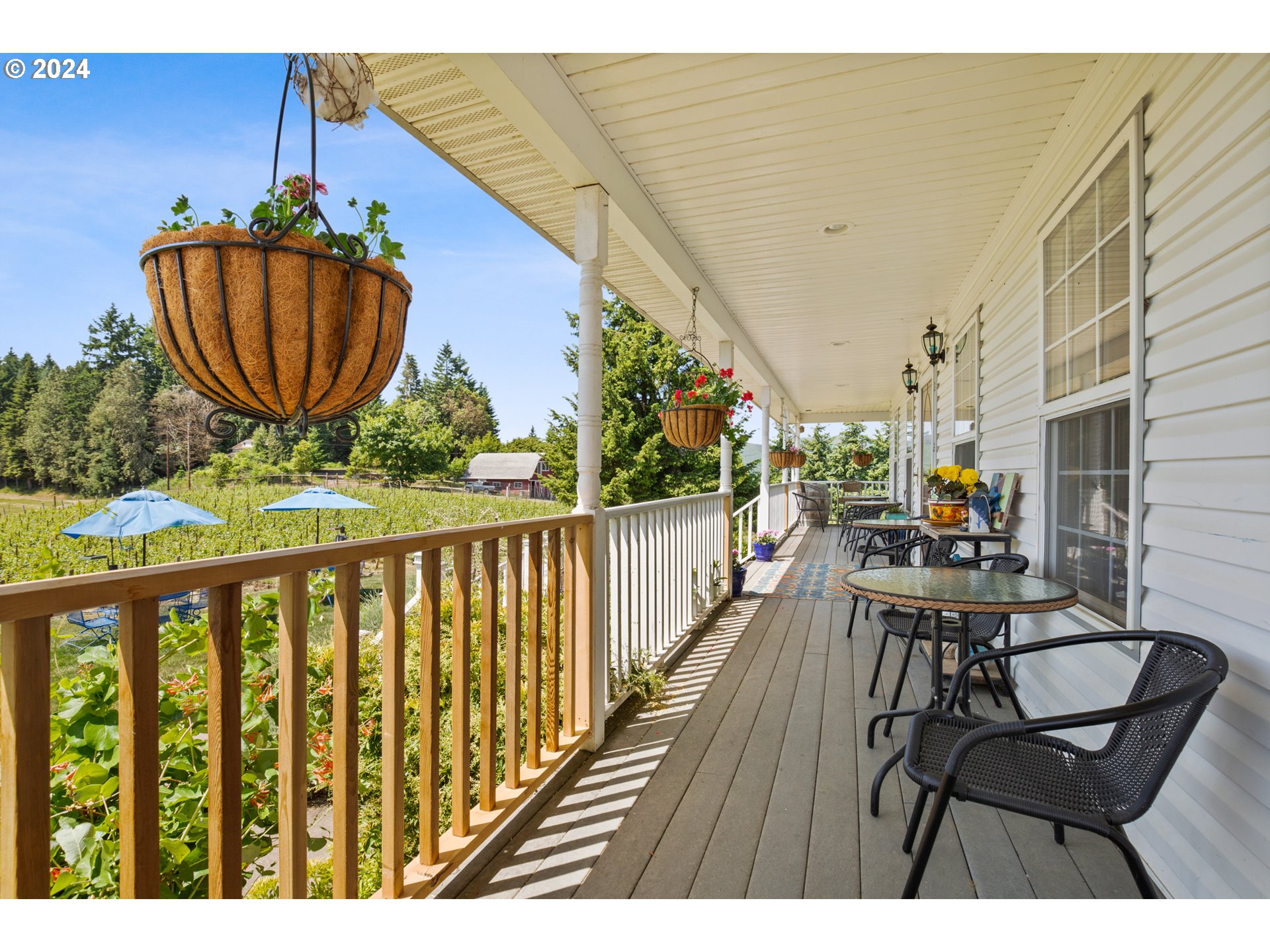 25059 Larson Road Monroe, OR 97456 - Photo 8 of 38 a balcony with wooden floor table and chairs