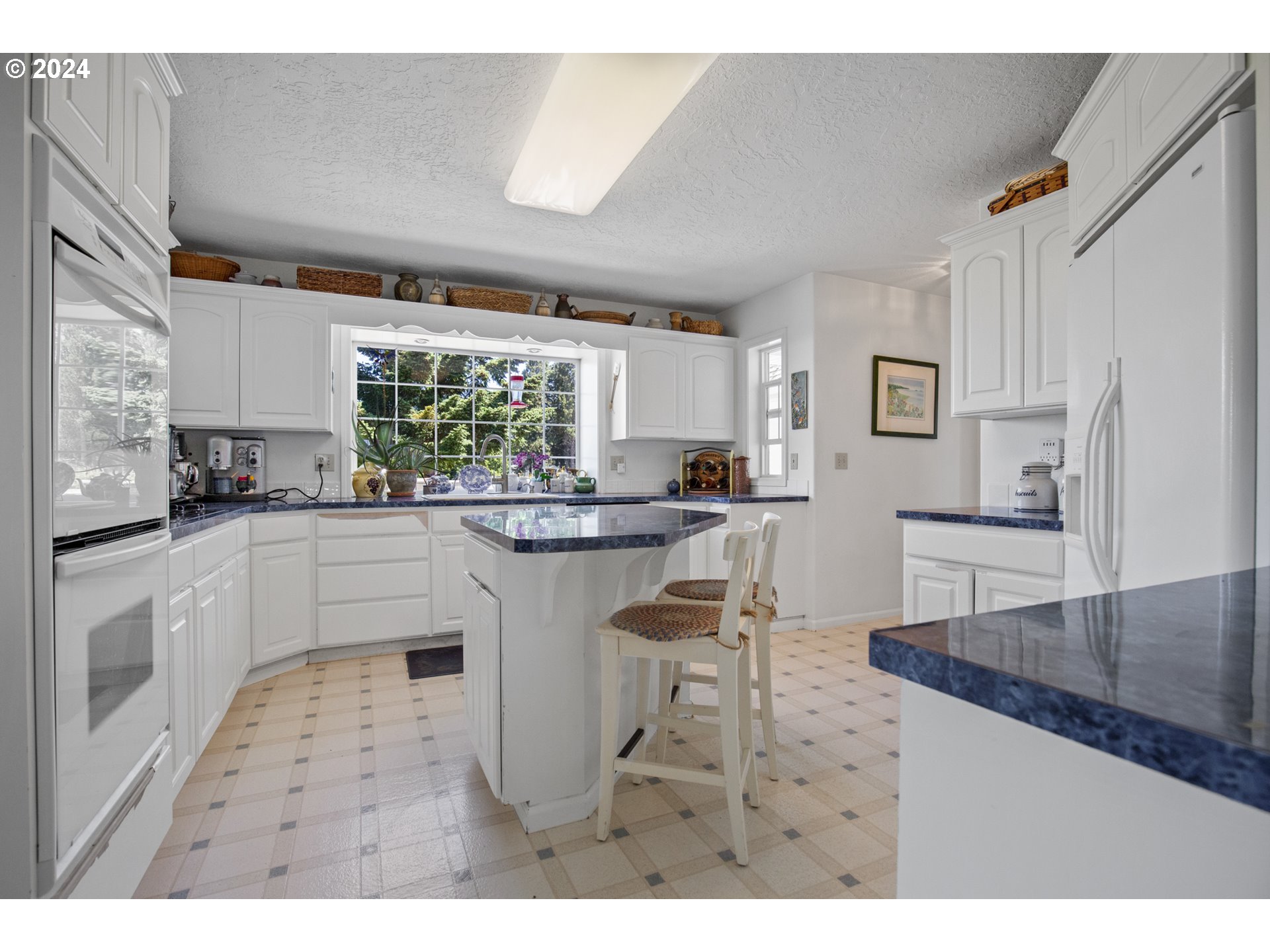 25059 Larson Road Monroe, OR 97456 - Photo 10 of 38 a kitchen with counter top space a sink appliances and cabinets