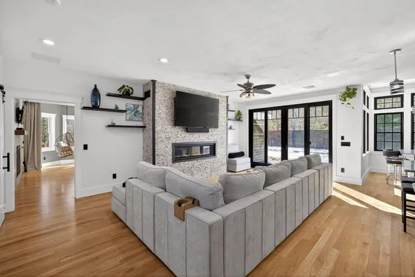 a living room with furniture and a flat screen tv