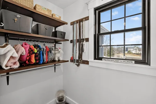 a bedroom with a large bed and a large window