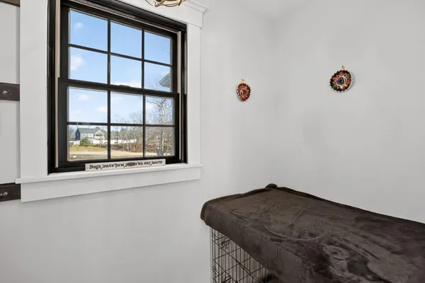a bedroom with a bed and a fireplace