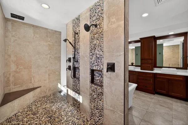 a view of a hallway with wooden floor and a potted plant