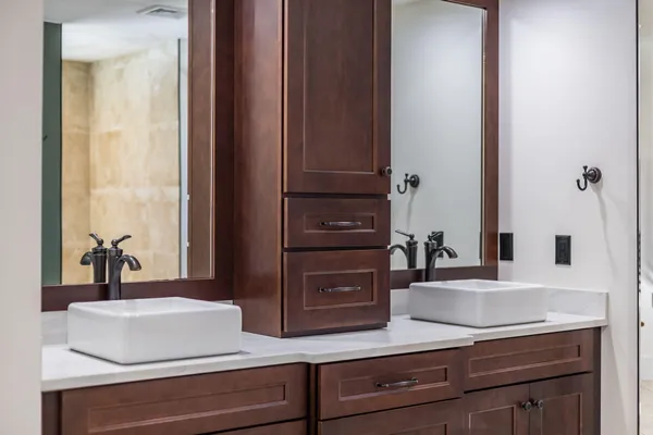a kitchen with stainless steel appliances kitchen island granite countertop a sink and cabinets