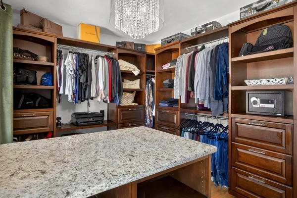 a view of bedroom with furniture and wooden floor