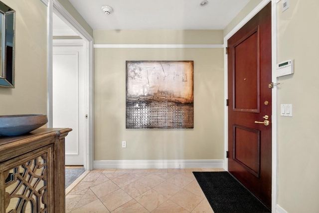 a view of hallway with wooden floor