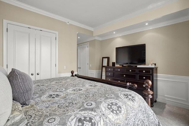 a bed room with a bed and a night stand