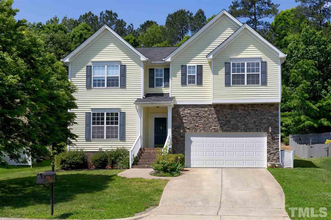 220 Mickleson Ridge Drive Raleigh, NC 27603 - Photo 1 of 20 a front view of a house with a yard and garage